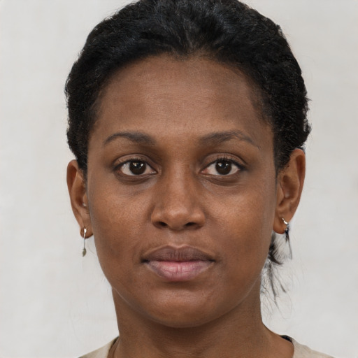 Neutral black young-adult female with short  brown hair and brown eyes