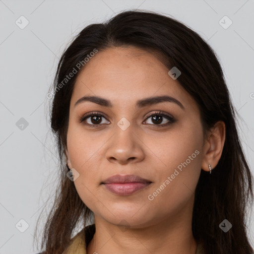 Joyful latino young-adult female with long  brown hair and brown eyes