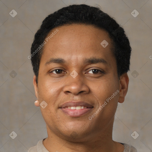 Joyful black adult male with short  brown hair and brown eyes