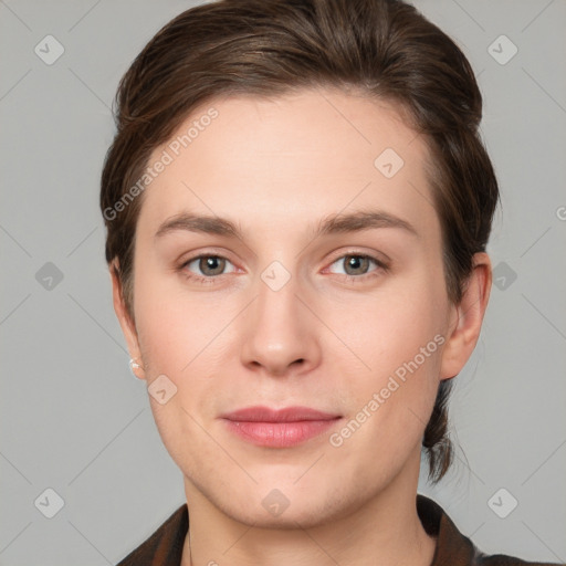 Joyful white young-adult female with short  brown hair and grey eyes