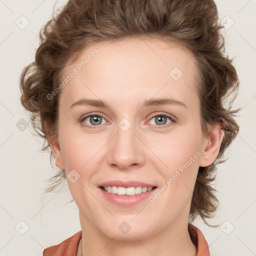 Joyful white young-adult female with medium  brown hair and blue eyes