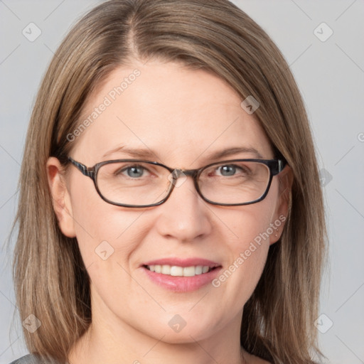 Joyful white adult female with medium  brown hair and grey eyes