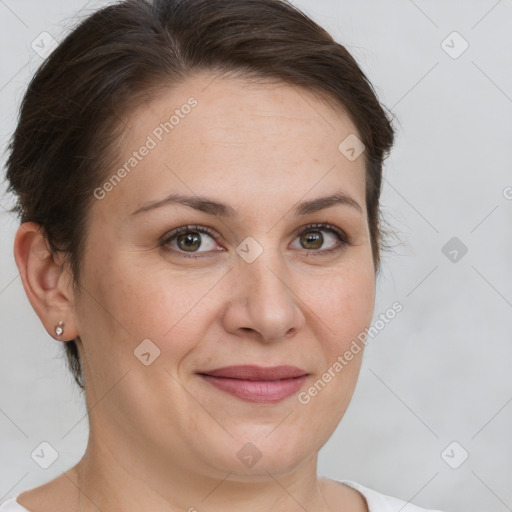 Joyful white adult female with short  brown hair and brown eyes