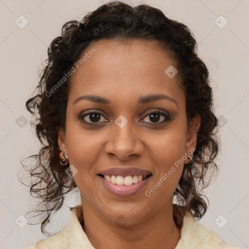 Joyful black young-adult female with medium  brown hair and brown eyes