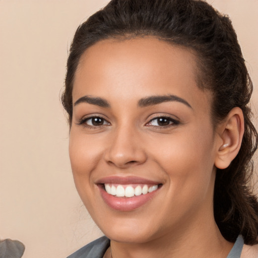 Joyful white young-adult female with long  brown hair and brown eyes