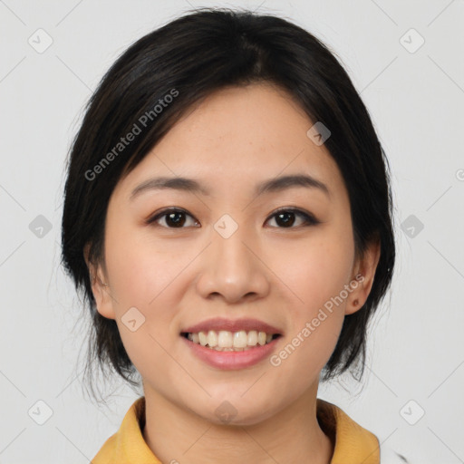 Joyful asian young-adult female with medium  black hair and brown eyes