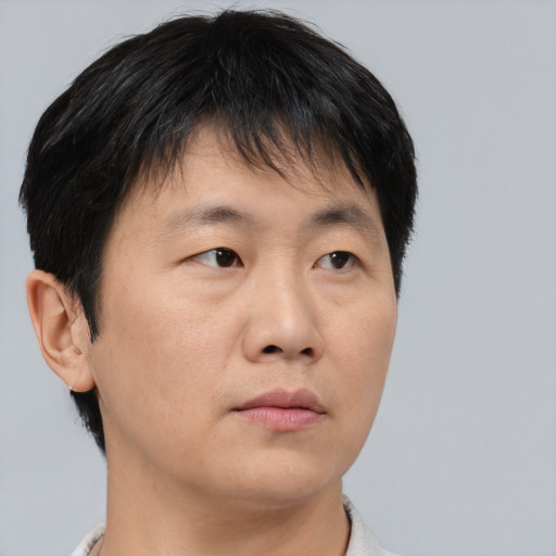 Neutral asian young-adult male with short  brown hair and brown eyes