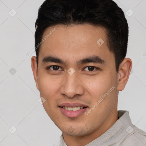 Joyful white young-adult male with short  brown hair and brown eyes