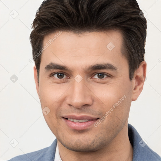 Joyful white young-adult male with short  brown hair and brown eyes