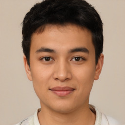 Joyful asian young-adult male with short  black hair and brown eyes