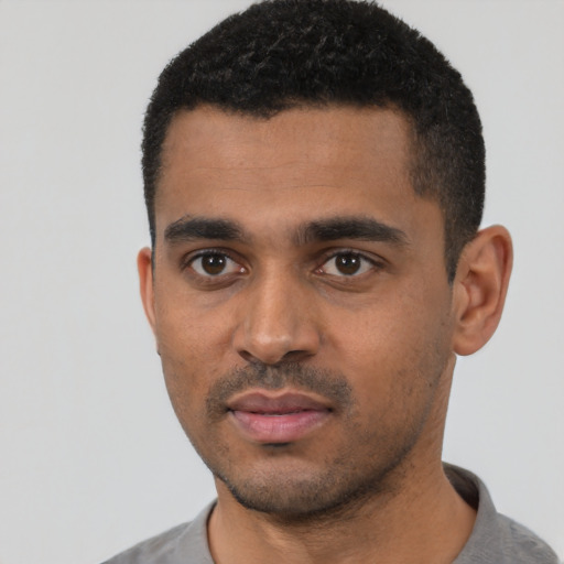 Neutral black young-adult male with short  black hair and brown eyes