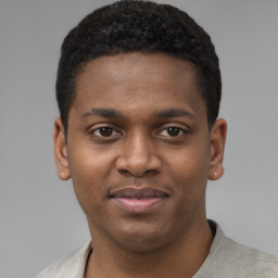 Joyful latino young-adult male with short  brown hair and brown eyes