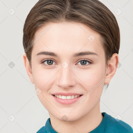 Joyful white young-adult female with short  brown hair and grey eyes