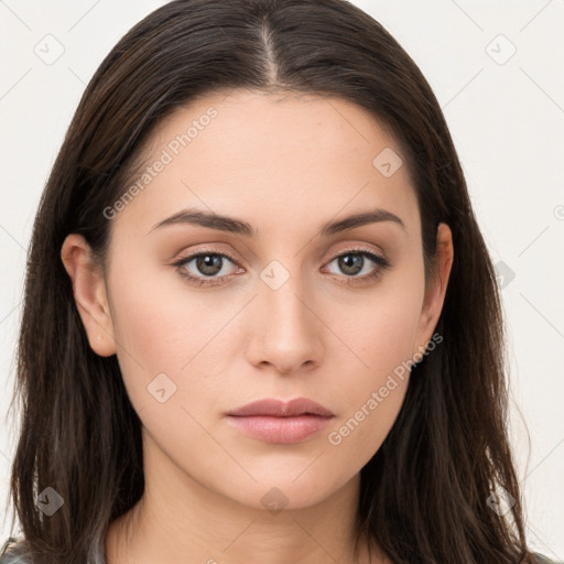 Neutral white young-adult female with long  brown hair and brown eyes