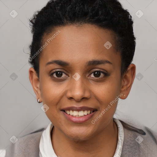 Joyful black young-adult female with short  black hair and brown eyes