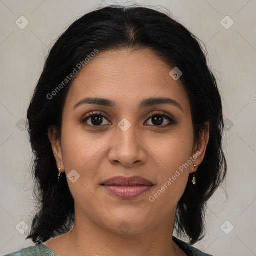 Joyful latino young-adult female with medium  brown hair and brown eyes