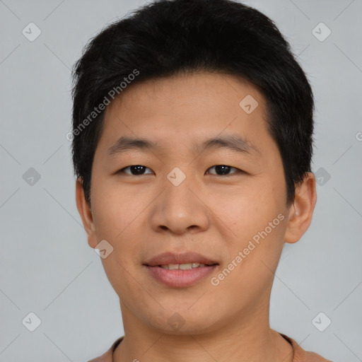 Joyful asian young-adult male with short  black hair and brown eyes