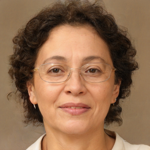 Joyful white middle-aged female with medium  brown hair and brown eyes