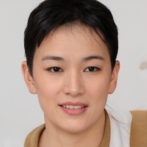 Joyful asian young-adult female with short  brown hair and brown eyes