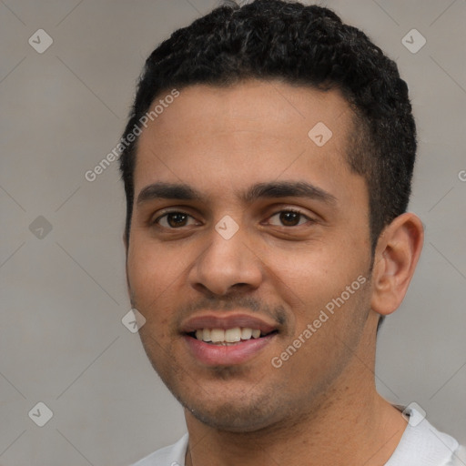 Joyful white young-adult male with short  black hair and brown eyes