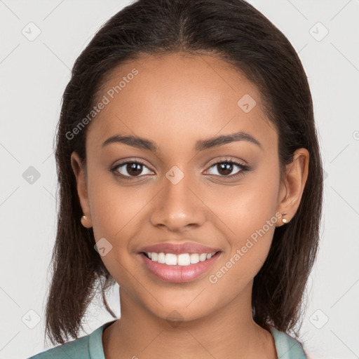 Joyful latino young-adult female with long  brown hair and brown eyes