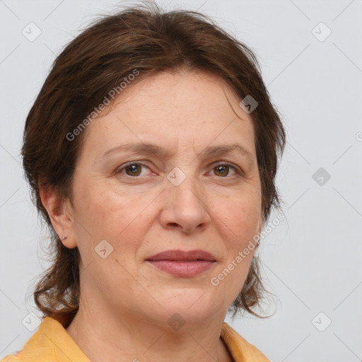 Joyful white adult female with medium  brown hair and brown eyes