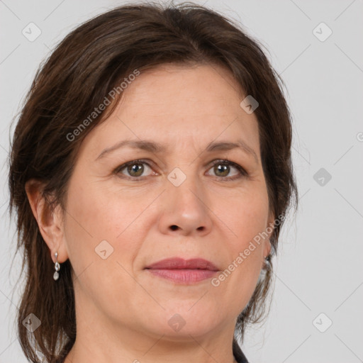 Joyful white adult female with medium  brown hair and grey eyes