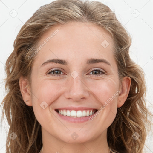 Joyful white young-adult female with long  brown hair and blue eyes