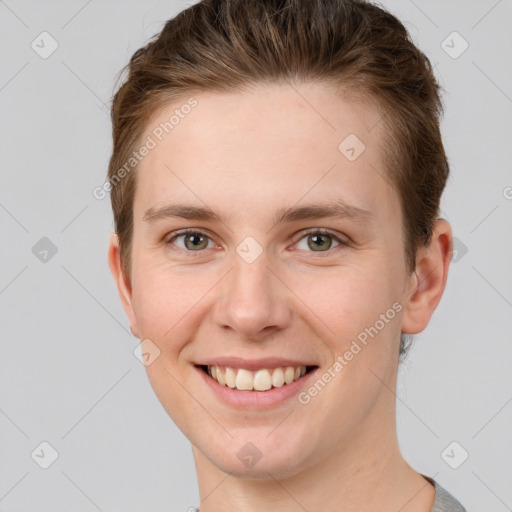 Joyful white young-adult female with short  brown hair and grey eyes