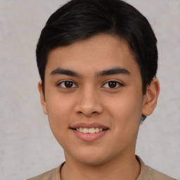 Joyful asian young-adult male with short  brown hair and brown eyes