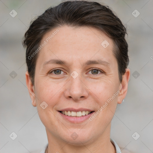 Joyful white adult female with short  brown hair and brown eyes