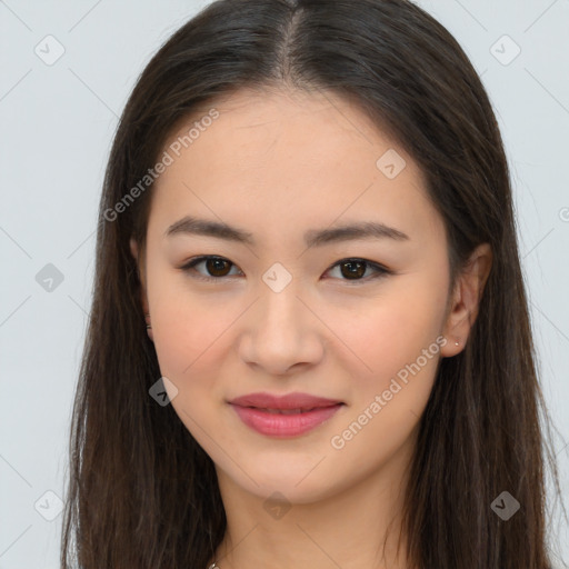 Joyful asian young-adult female with long  brown hair and brown eyes