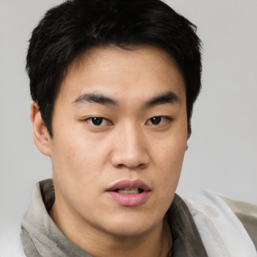 Neutral asian young-adult male with short  black hair and brown eyes