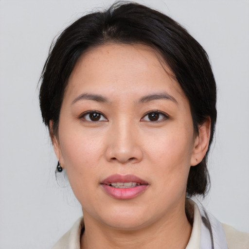 Joyful white young-adult female with medium  brown hair and brown eyes