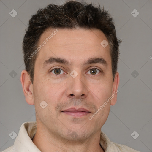 Joyful white adult male with short  brown hair and brown eyes