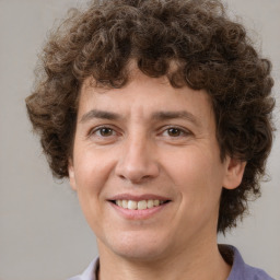 Joyful white young-adult male with medium  brown hair and brown eyes