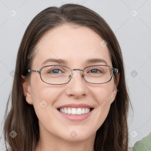 Joyful white young-adult female with long  brown hair and grey eyes