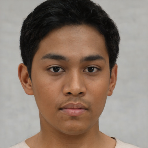 Neutral asian young-adult male with short  brown hair and brown eyes
