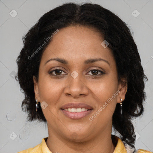 Joyful latino adult female with medium  brown hair and brown eyes