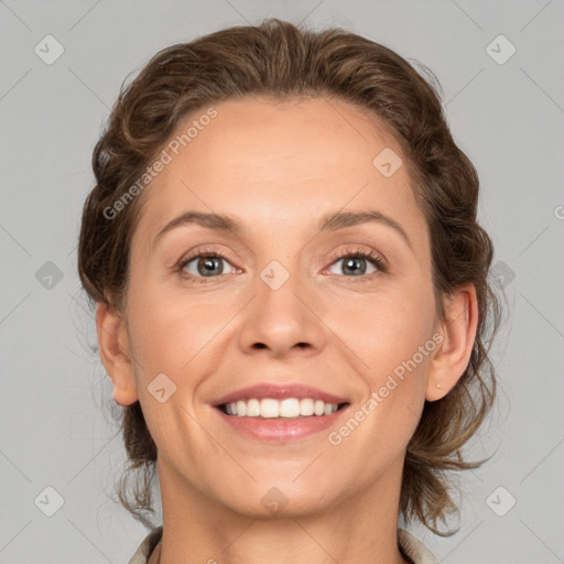 Joyful white adult female with medium  brown hair and grey eyes