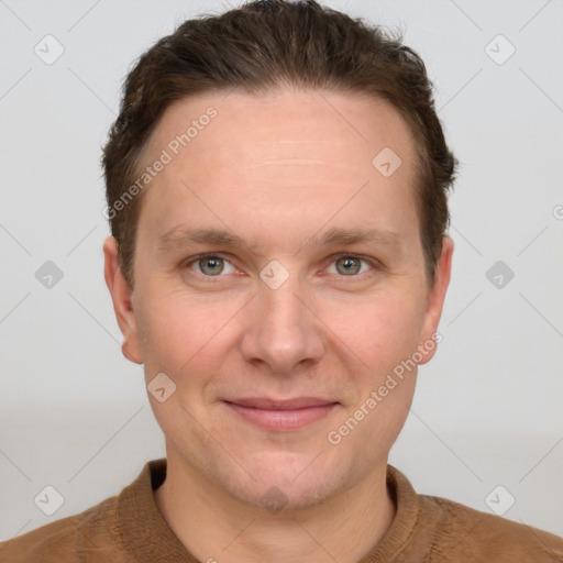 Joyful white adult male with short  brown hair and grey eyes