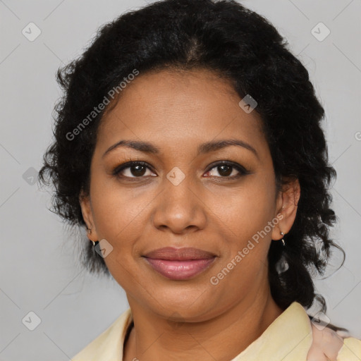 Joyful black adult female with medium  brown hair and brown eyes