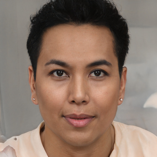 Joyful latino young-adult female with short  brown hair and brown eyes