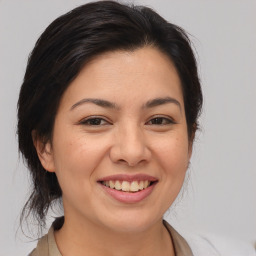 Joyful asian young-adult female with medium  brown hair and brown eyes