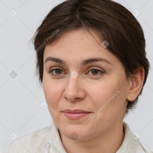 Joyful white adult female with medium  brown hair and grey eyes