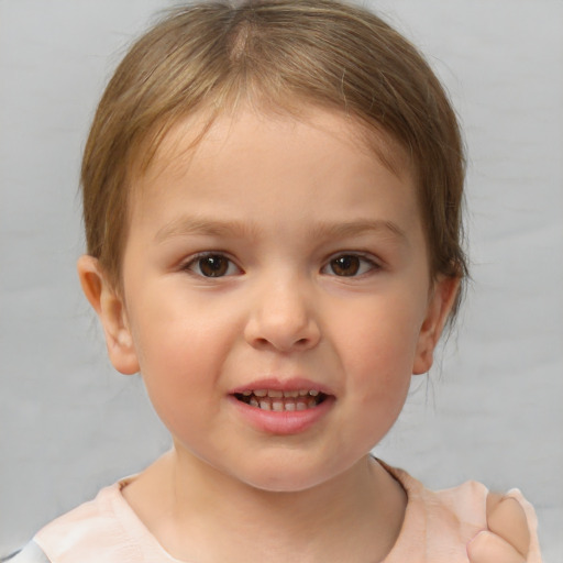 Joyful white child female with short  brown hair and brown eyes