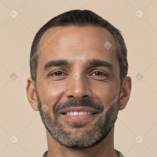 Joyful white adult male with short  black hair and brown eyes