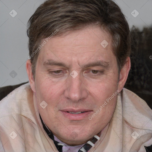 Joyful white adult male with medium  brown hair and brown eyes