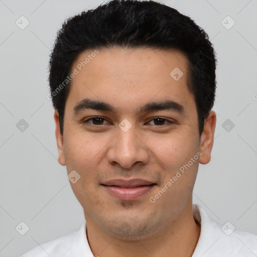 Joyful latino young-adult male with short  black hair and brown eyes