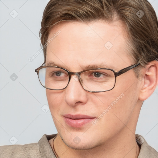 Joyful white adult male with short  brown hair and grey eyes